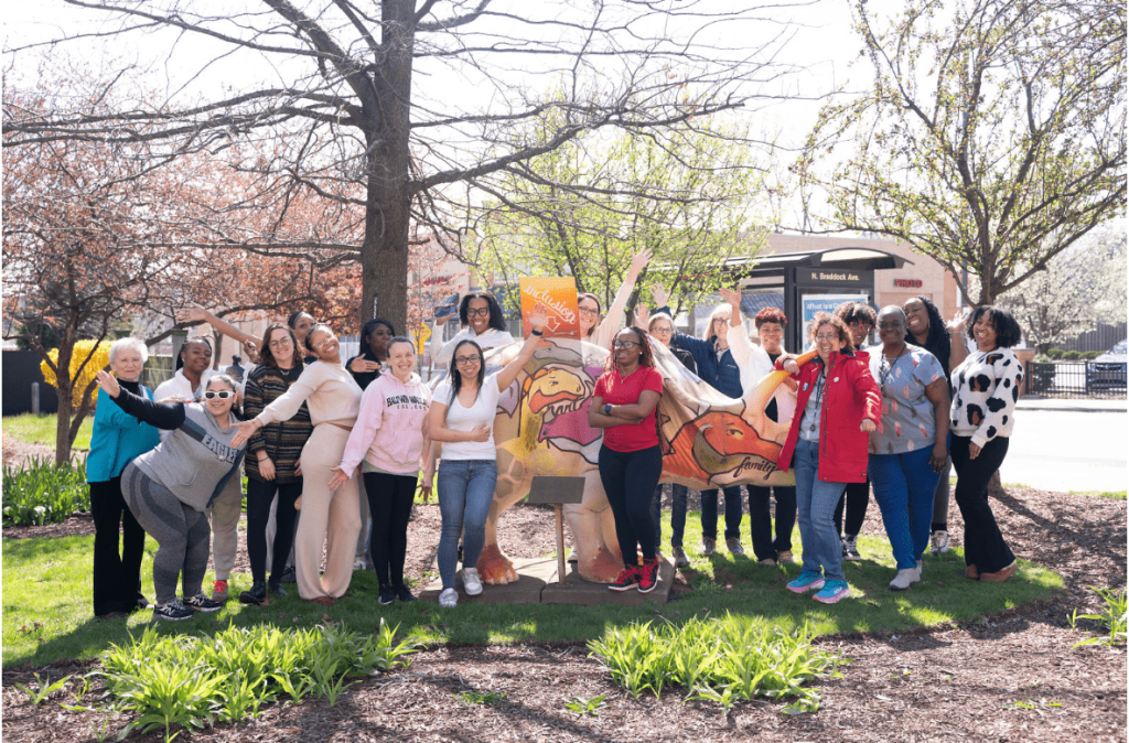 A photo of the Shady Lane School staff standing outside.